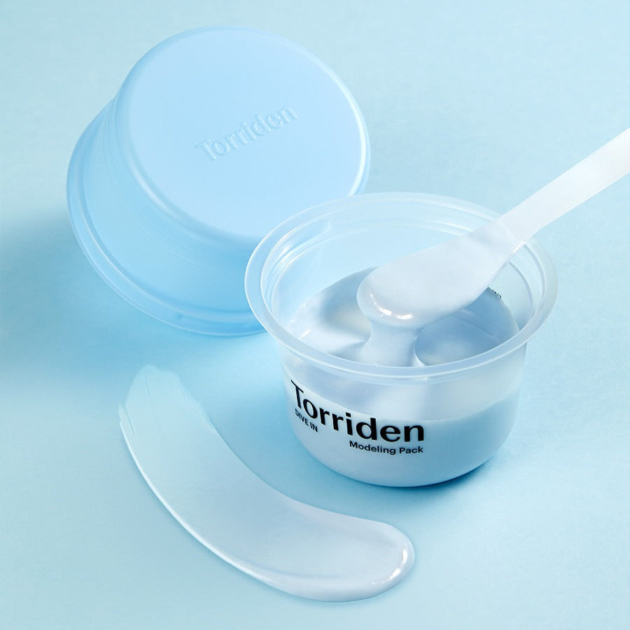 TORRIDEN Dive In Low olecular Hyaluronic Acid Modeling Pack with spoon, open container, and product sample on light blue background