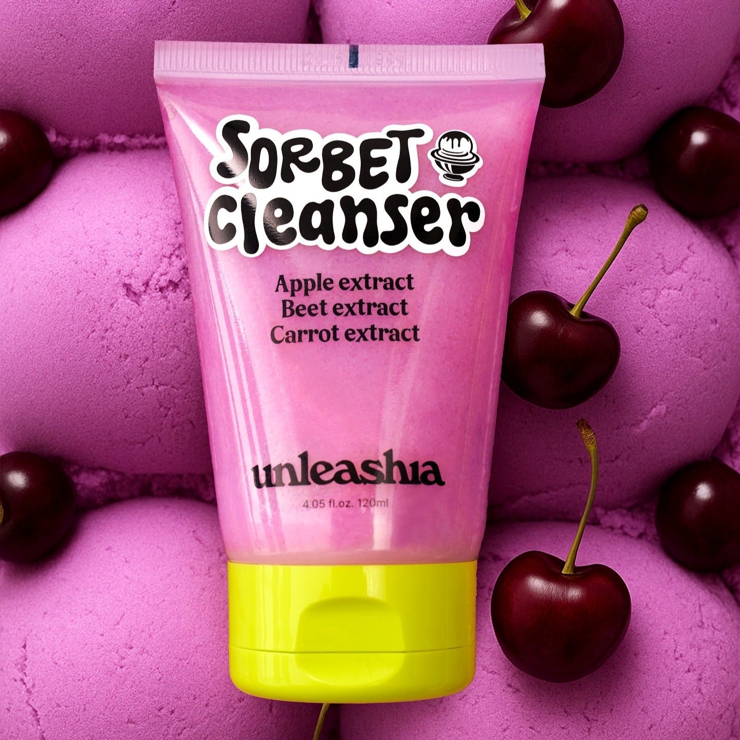 UNLEASHIA ABC Sorbat Facial Cleanser 120ml with apple, beet, and carrot extracts surrounded by cherries on pink background.