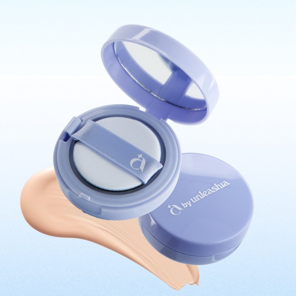 UNLEASHIA Be Be Blue Cushion makeup compact with cushion puff and foundation swatch on background
