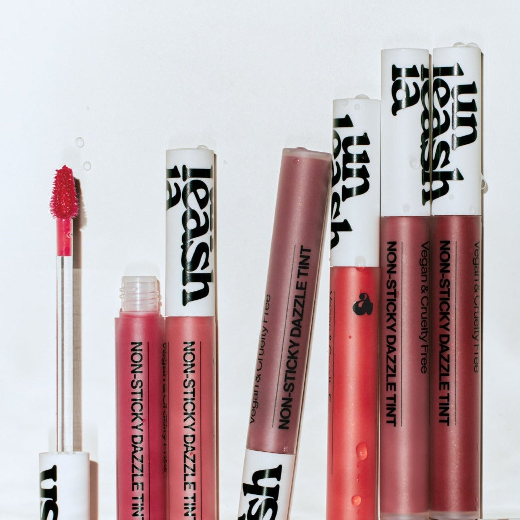 UNLEASHIA Non-Sticky Dazzle Tint in multiple shades, showcasing vibrant lip color options with vegan and cruelty-free formula.