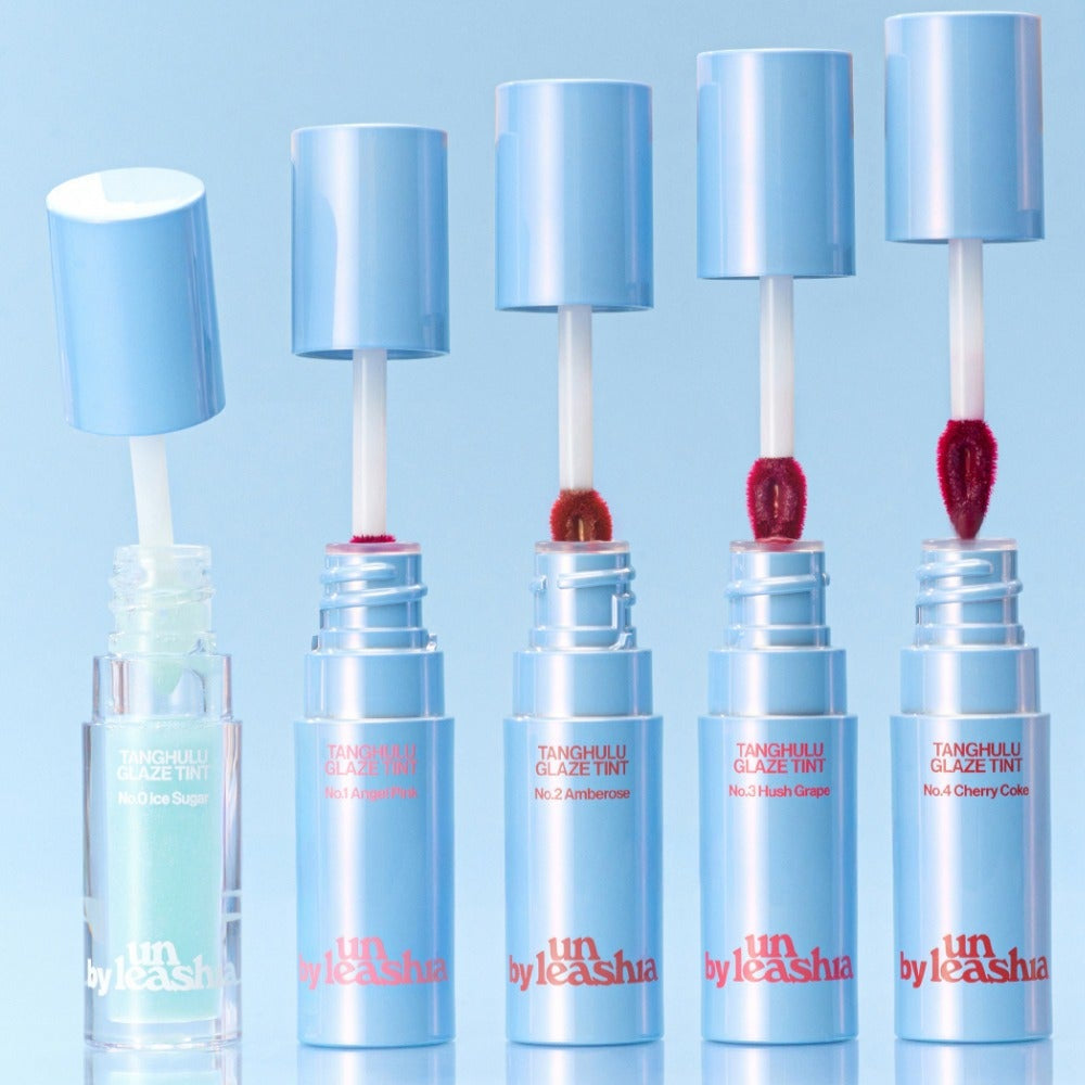 Five UNLEASHIA Tanghulu Glaze Tint tubes in different shades on a blue background.