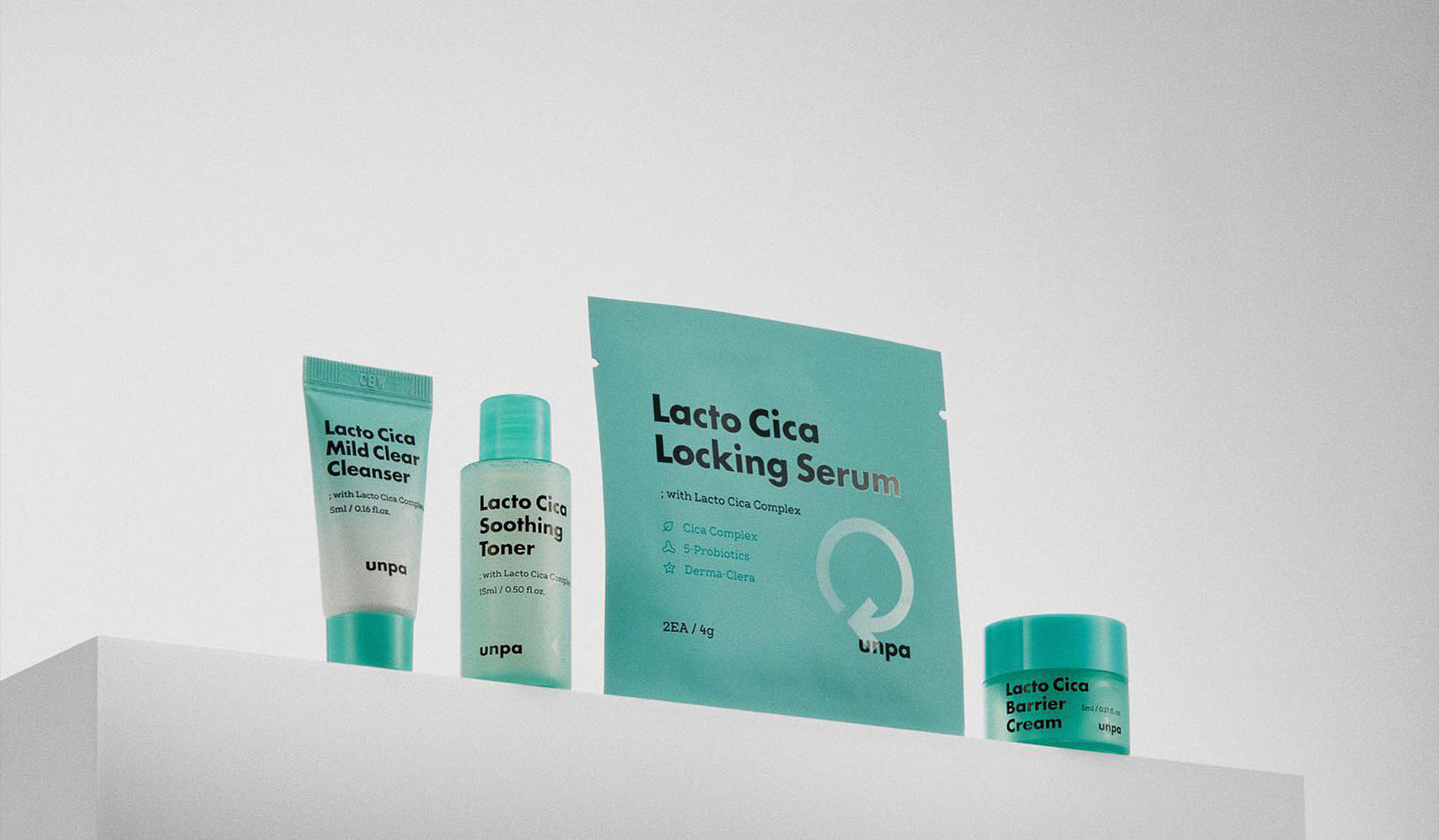 Skincare products including Lacto Cica Locking Serum, cleanser, toner, and cream displayed on a white shelf.