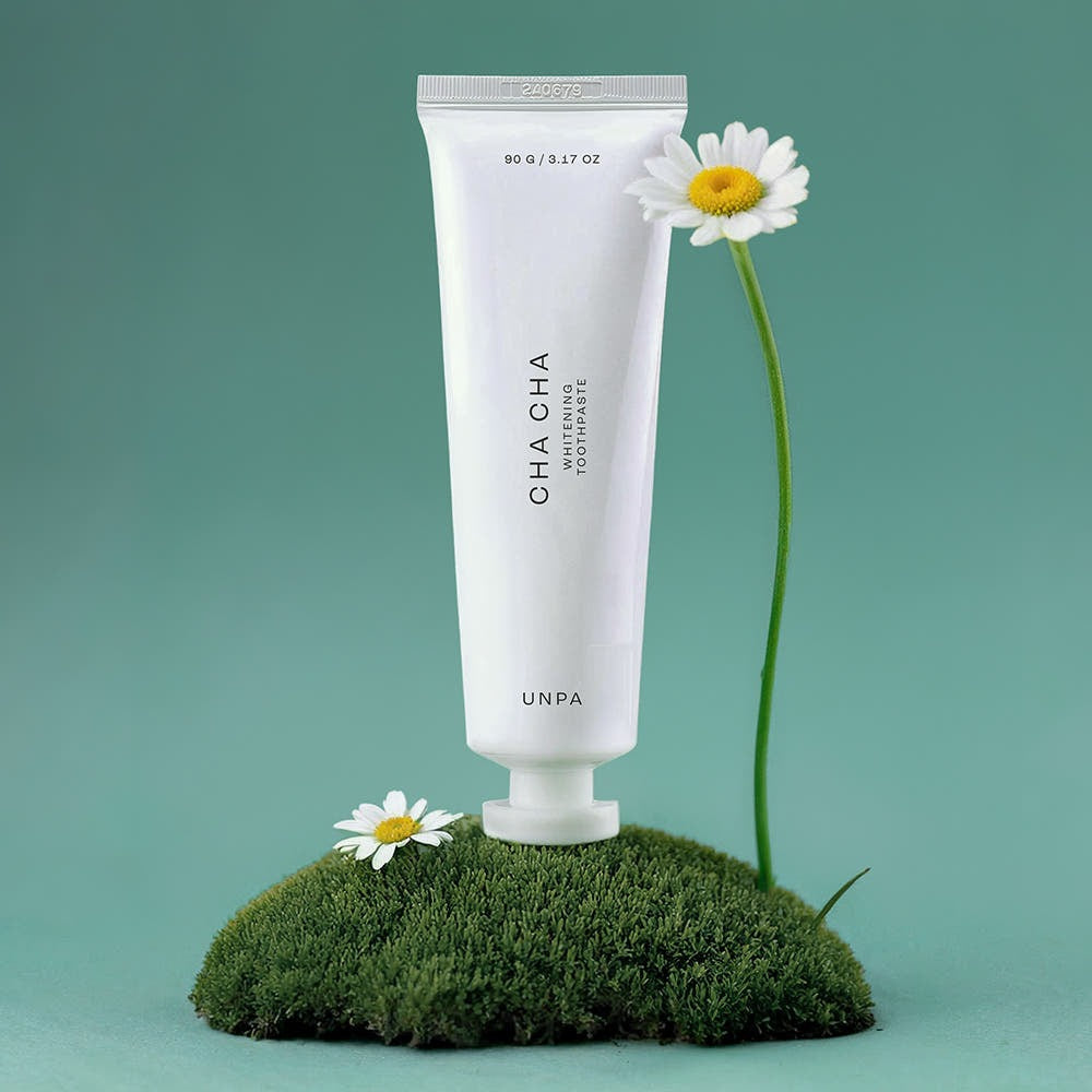 UNPA Chacha French Chamomile Vegan Whitening Toothpaste 90g displayed with chamomile flowers and green background