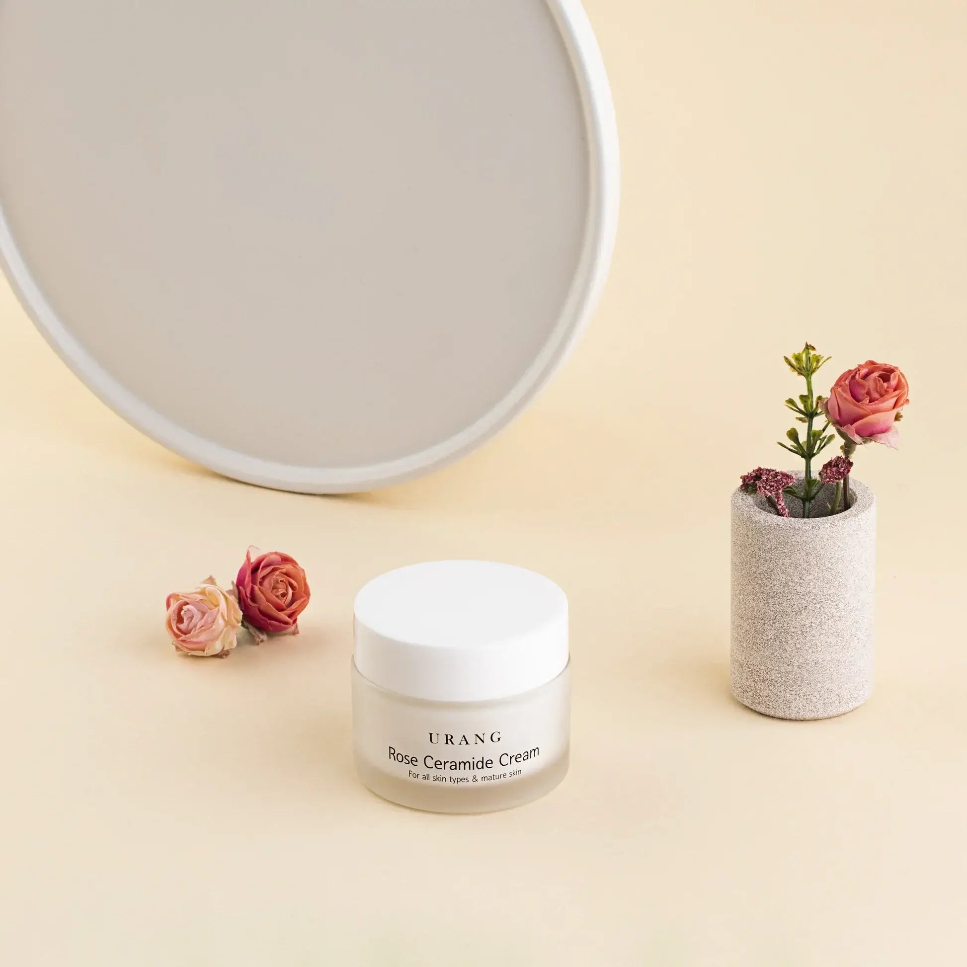 URANG Rose Ceramide Cream 50ml displayed next to decorative flowers.