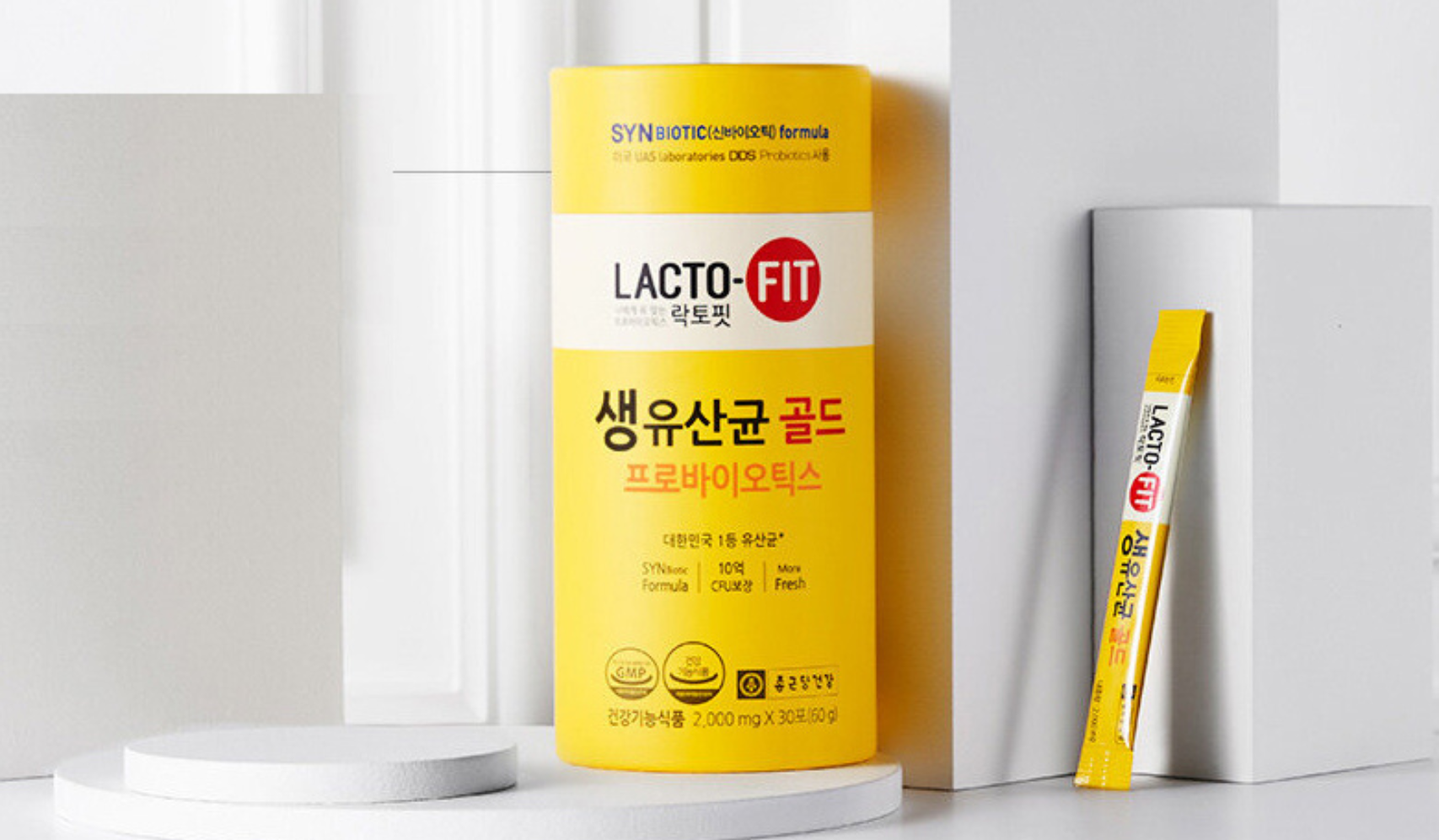 Lacto-Fit probiotic supplement in yellow packaging with individual stick pack for digestive health.