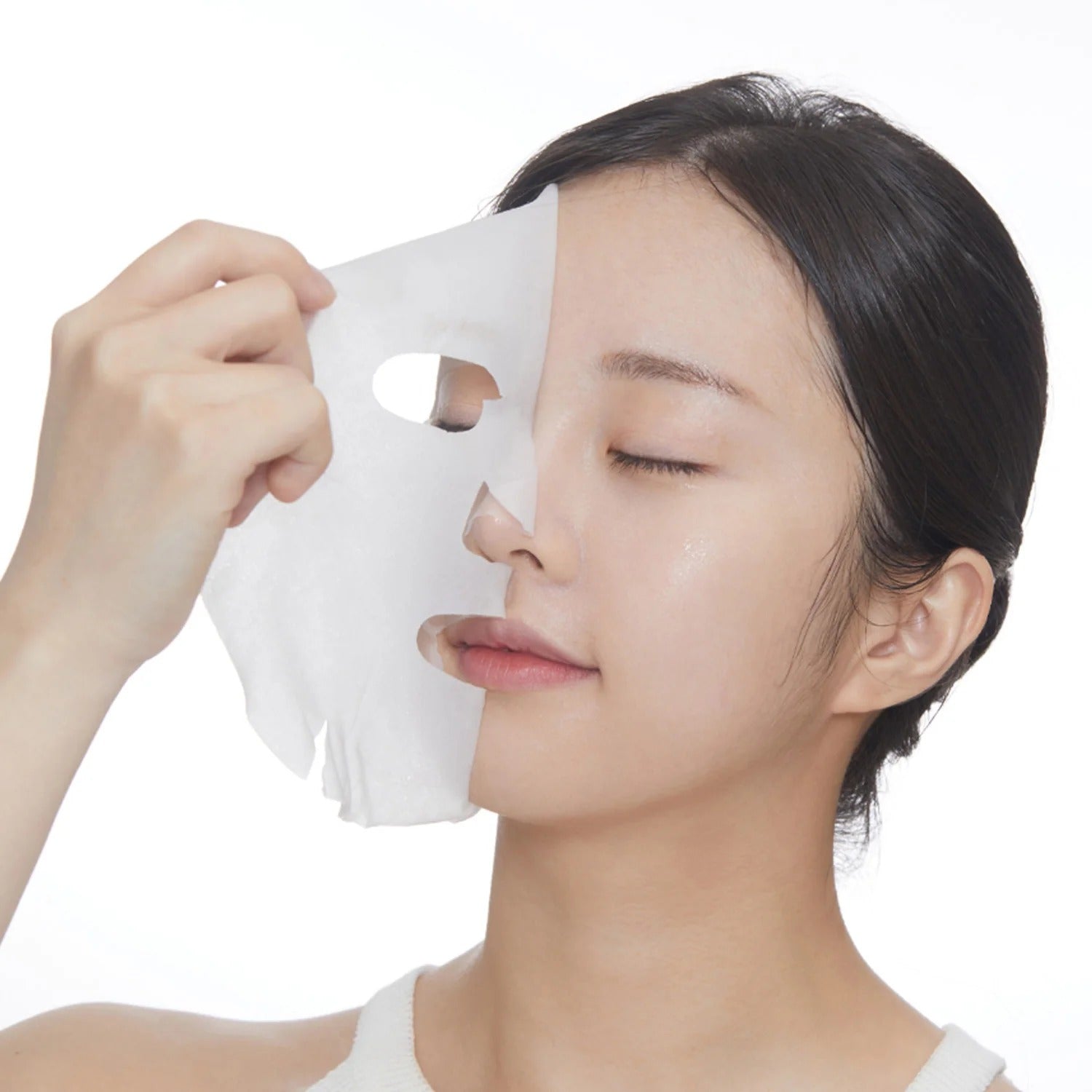 Woman applying VT COSMETIC PDRN Daily Mask 30 Sheets for skincare
