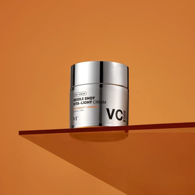 VT COSMETIC Riddle Shot Vita-Light Cream 50ml on orange background