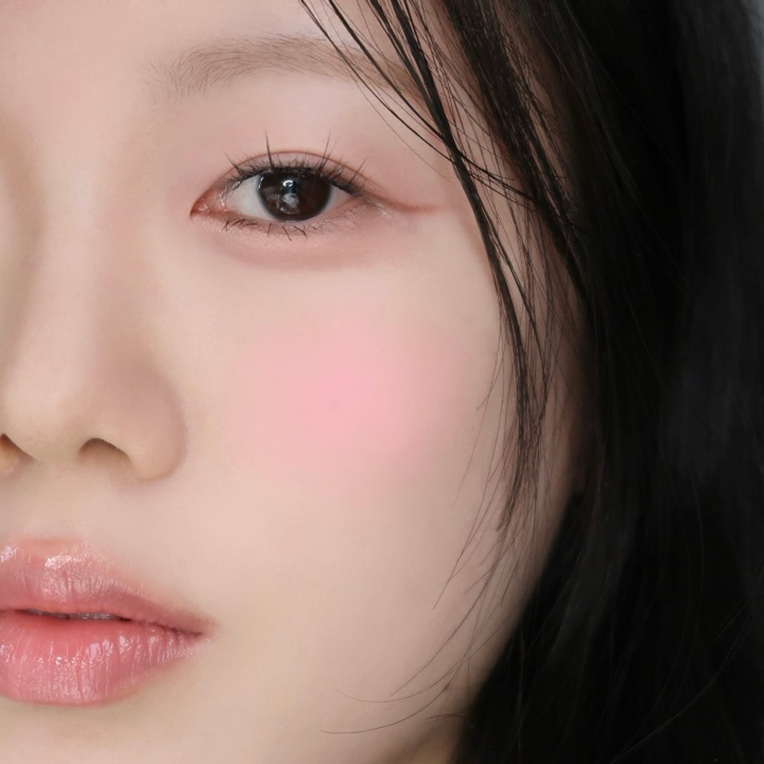 Model wearing WAKE MAKE Sheer Breeze Blusher 5g, highlighting a natural rosy cheek look.
