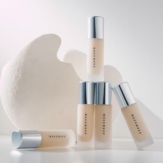 WAKEMAKE Water Velvet Cover Foundation bottles displayed elegantly against a minimalist background.