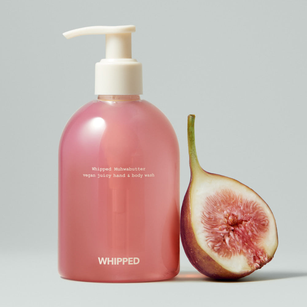 WHIPPED Muhwabutter Vegan Juicy Hand & Body Wash 290ml bottle with a fig beside it.