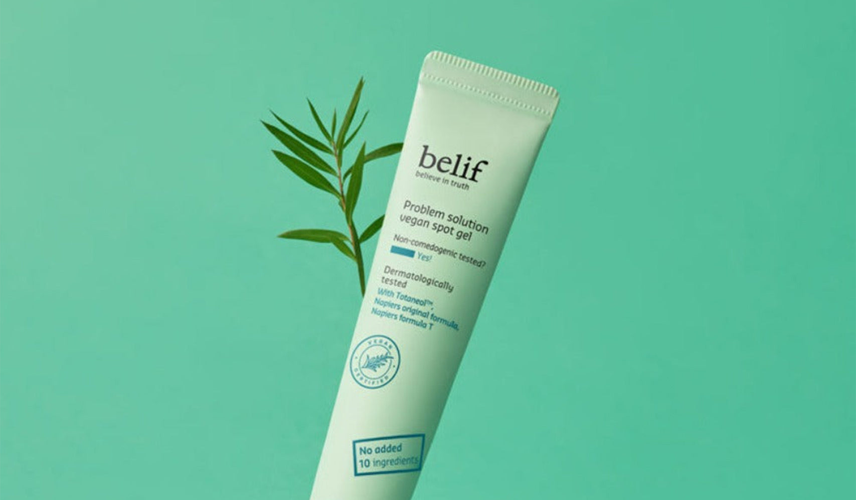 Belif problem solution moisturizer tube with green background and plant accent, promoting vegan skincare.