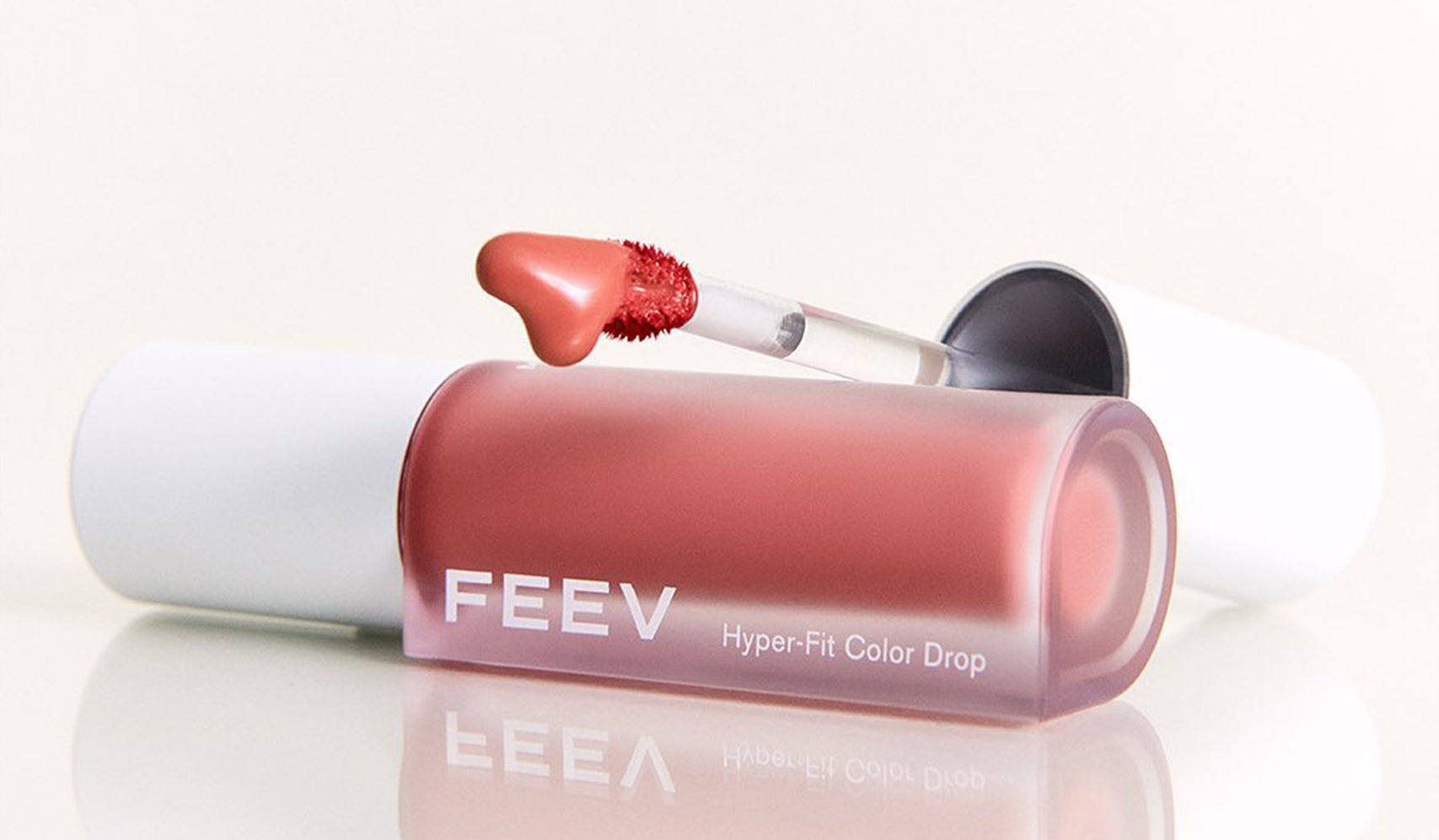 Feev Hyper-Fit Color Drop lipstick with heart-shaped applicator on white background