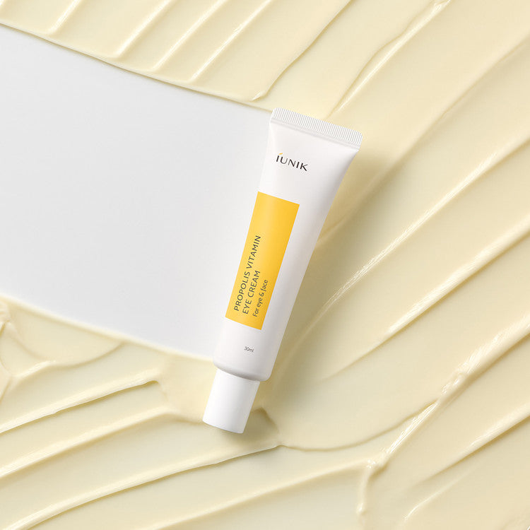 iUNIK Propolis Vitamin Eye Cream 30ml tube on cream background