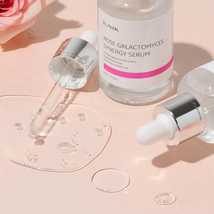 iUNIK Rose Galactomyces Synergy Serum 50ml bottle with dropper and rose background - premium skincare product image