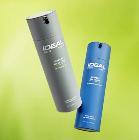 Grey and blue Ideal for Men skincare bottles on a green background, featuring anti-wrinkle and intensive moisture formulas.
