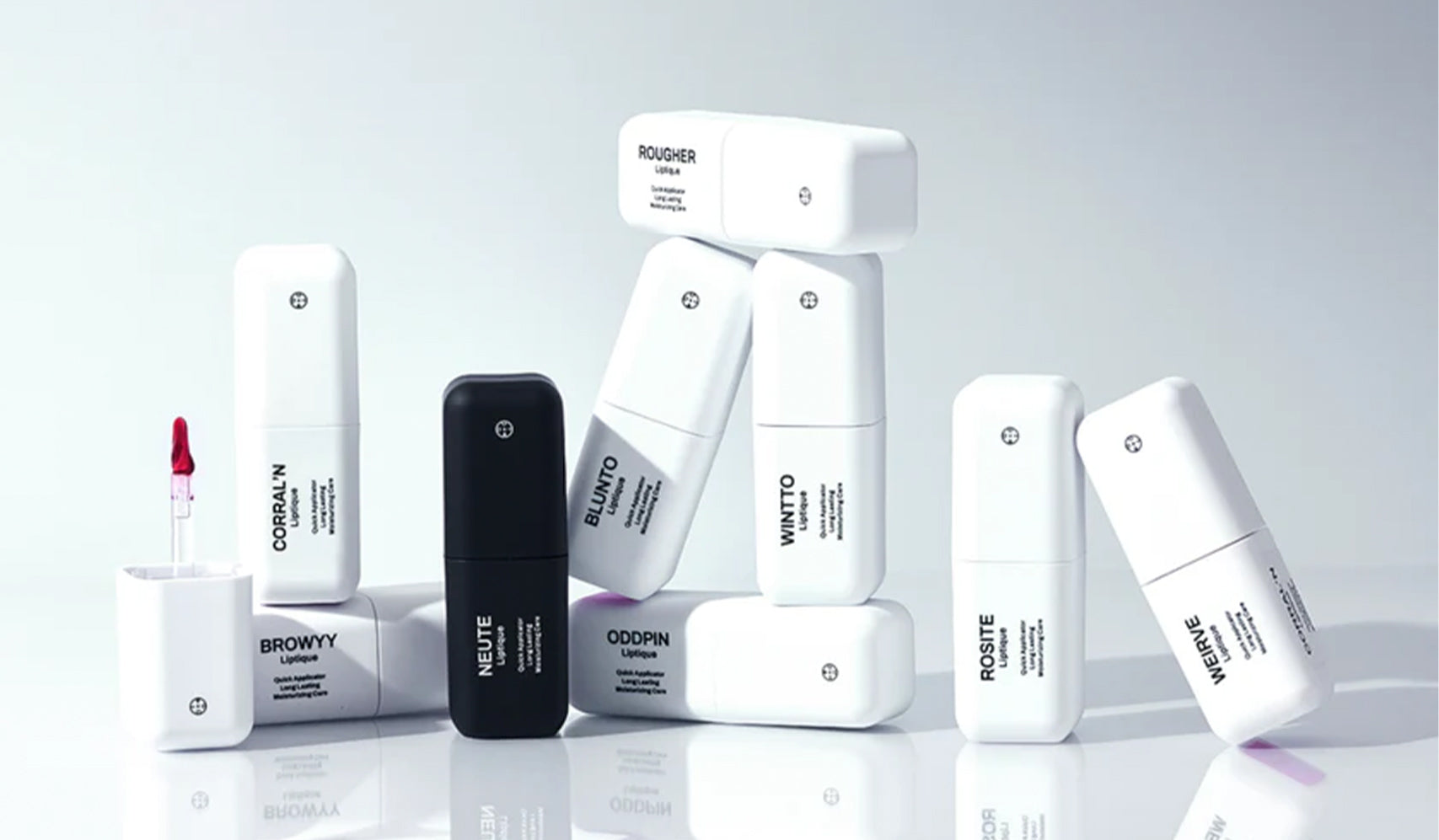Assorted skincare product bottles in sleek white and black packaging, artistically stacked on a reflective surface.